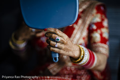 Indian bride showing her mehndi and ring Indian bride showing her mehndi and ring