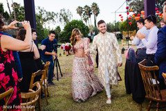 Joyful newlyweds leaving the ceremony venue Joyful newlyweds leaving the ceremony venue