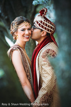 Indian groom kissing the beautiful Maharani Indian groom kissing the beautiful Maharani