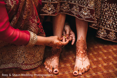 Maharani being assisted with Mehndi Maharani being assisted with Mehndi