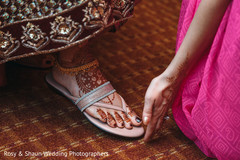 Indian bride being assisted with feet Mehndi Indian bride being assisted with feet Mehndi