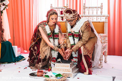 Indian couple lighting the sacred fire Indian couple lighting the sacred fire