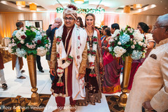 Indian couple exiting their wedding ceremony Indian couple exiting their wedding ceremony