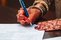 Indian bride signing marriage certificate Indian bride signing marriage certificate