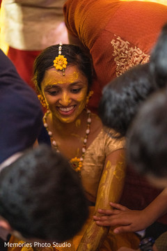 Indian bride getting Turmeric paste on her arms. Indian bride getting Turmeric paste on her arms.
