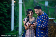 Indian groom admiring bridal henna art. Indian groom admiring bridal henna art.