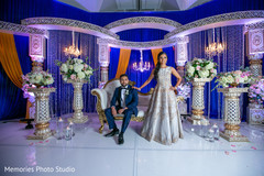 Fabulous Indian bride and groom posing at reception stage. Fabulous Indian bride and groom posing at reception stage.