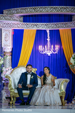 See this Indian couple at their reception celebration. See this Indian couple at their reception celebration.