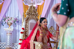Joyful Indian bride by looking at groom. Joyful Indian bride by looking at groom.