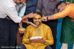 Indian groom getting the turmeric paste on. Indian groom getting the turmeric paste on.