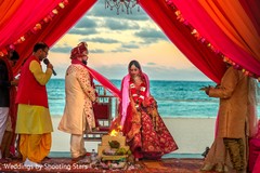 Indian bride and groom walking around the sacred fire. Indian bride and groom walking around the sacred fire.