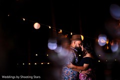Romantic capture of Indian bride and groom at sangeet dance. Romantic capture of Indian bride and groom at sangeet dance.