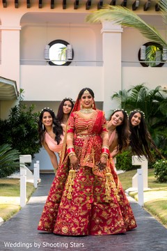 Adorable Indian bride posing with bridesmaids. Adorable Indian bride posing with bridesmaids.