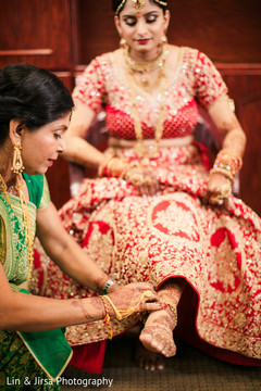 Maharani getting her anklet on. Maharani getting her anklet on.