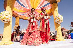 Indian bride and groom at their garland exchange ritual. Indian bride and groom at their garland exchange ritual.