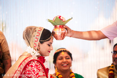 Sweet shot of bride during wedding ritual. Sweet shot of bride during wedding ritual.