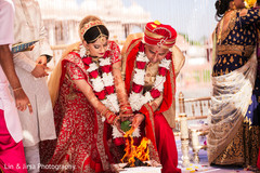 Indian bride and groom liting up sacred fire. Indian bride and groom liting up sacred fire.