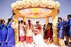 Joyful Indian bride and groom walking around sacred fire. Joyful Indian bride and groom walking around sacred fire.