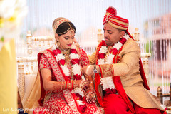 Indian bride and groom at their Mangalsutra ritual capture. Indian bride and groom at their Mangalsutra ritual capture.