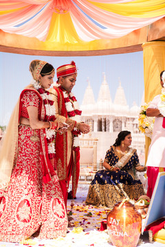 Indian bride and groom holding leaf on the wedding ceremony ritual. Indian bride and groom holding leaf on the wedding ceremony ritual.