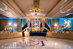 Incredible Indian wedding reception dance floor and stage decor. Incredible Indian wedding reception dance floor and stage decor.