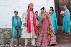Indian bride and groom with special guests Indian bride and groom with special guests