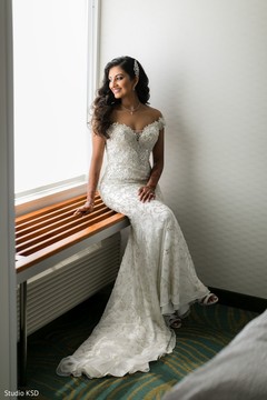 Enchanting Indian bride on her white wedding dress. Enchanting Indian bride on her white wedding dress.