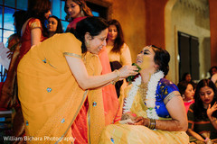 Maharani getting turmeric paste on her face. Maharani getting turmeric paste on her face.
