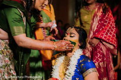Indian bride getting Turmeric paste on. Indian bride getting Turmeric paste on.