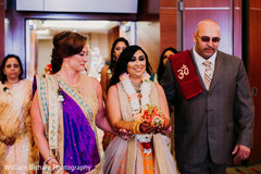 Indian bride walking in to her roka ritual celebration. Indian bride walking in to her roka ritual celebration.