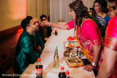 Indian groom getting food from mother in law. Indian groom getting food from mother in law.