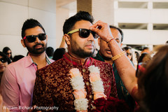 Indian groom getting the red mark on his forehead. Indian groom getting the red mark on his forehead.