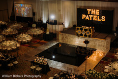 Stunning Indian wedding reception stage decor and dance floor. Stunning Indian wedding reception stage decor and dance floor.