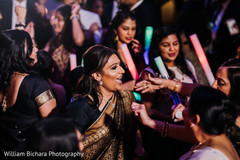 Joyful Indian wedding guests reception dance. Joyful Indian wedding guests reception dance.