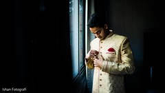 Indian groom getting his sherwani on. Indian groom getting his sherwani on.
