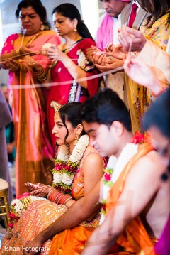 Indian bride and groom's capture during the rice blessing. Indian bride and groom's capture during the rice blessing.