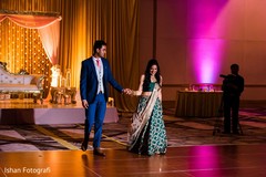 Indian bride and groom entering their reception party. Indian bride and groom entering their reception party.