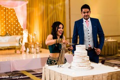 Indian couple at their cutting cake capture. Indian couple at their cutting cake capture.