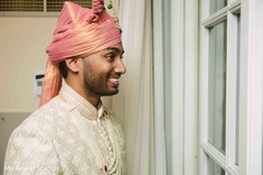 Indian groom looking out the window. Indian groom looking out the window.