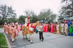 Elegant Indian groom riding his white horse. Elegant Indian groom riding his white horse.