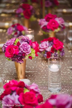 Lovely Indian wedding table flowers decor. Lovely Indian wedding table flowers decor.