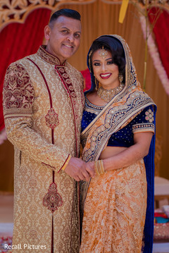 Stunning Indian bride posing with parent. Stunning Indian bride posing with parent.
