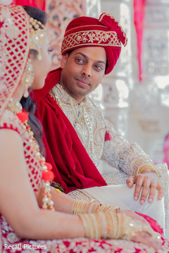 Charming groom looking at bride photo. Charming groom looking at bride photo.