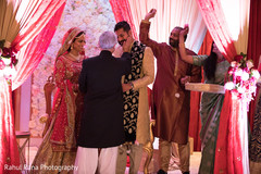 Indian groom being greeted by family Indian groom being greeted by family