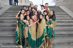 Indian newlyweds posing with bridesmaids and groomsmen Indian newlyweds posing with bridesmaids and groomsmen