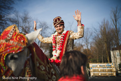Elegant Indian groom during the Baraat celebration. Elegant Indian groom during the Baraat celebration.