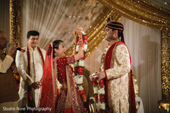 Indian bide putting garland to groom. Indian bide putting garland to groom.