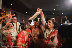 Indian bridesmaid holding groom's mojari. Indian bridesmaid holding groom's mojari.