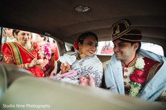 Joyful Indian couple leaving their wedding. Joyful Indian couple leaving their wedding.