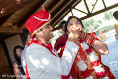 Indian groom sharing a bite with Maharani Indian groom sharing a bite with Maharani